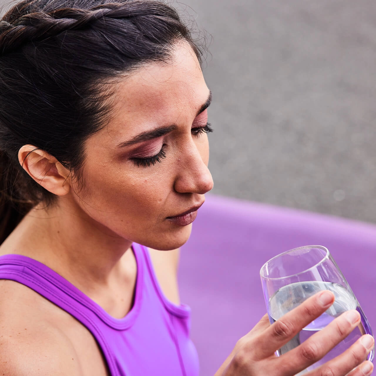 Water and nutrition Athletic woman with glass of water