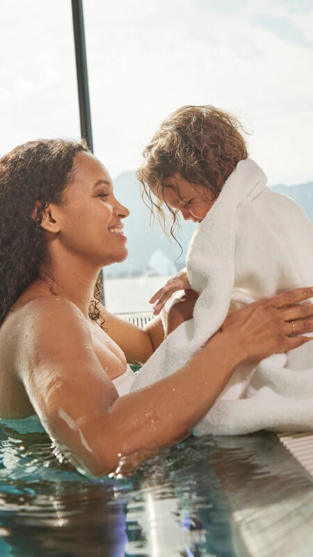 BWT Water for the Pool Woman with Baby in BWT Pool