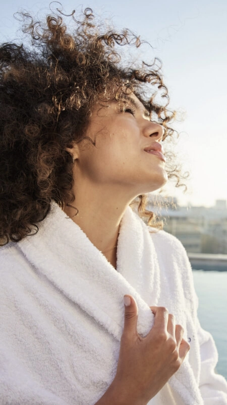 Woman in Bathrobe in Front of BWT Pool