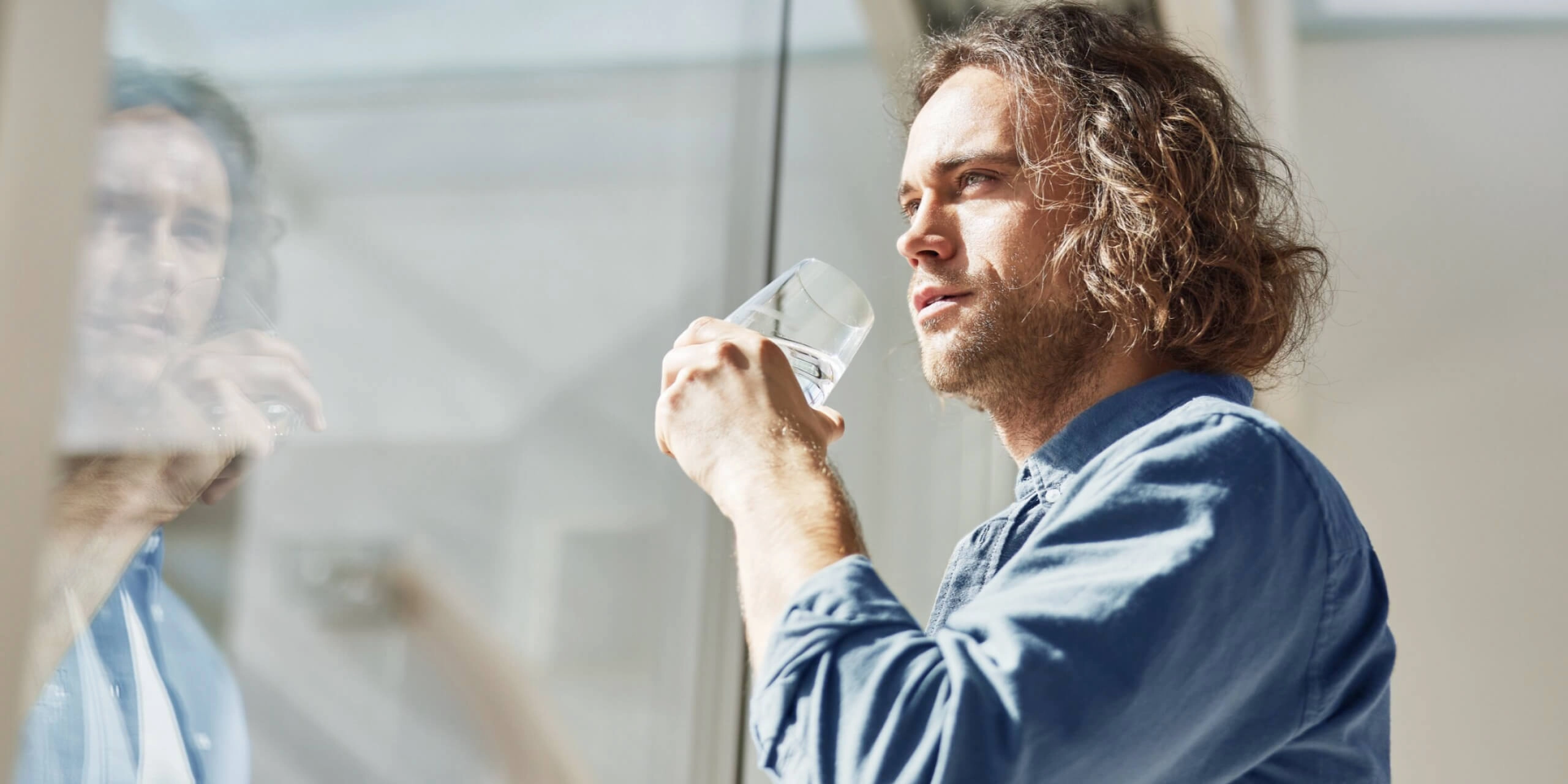 Man drinks from BWT water glass