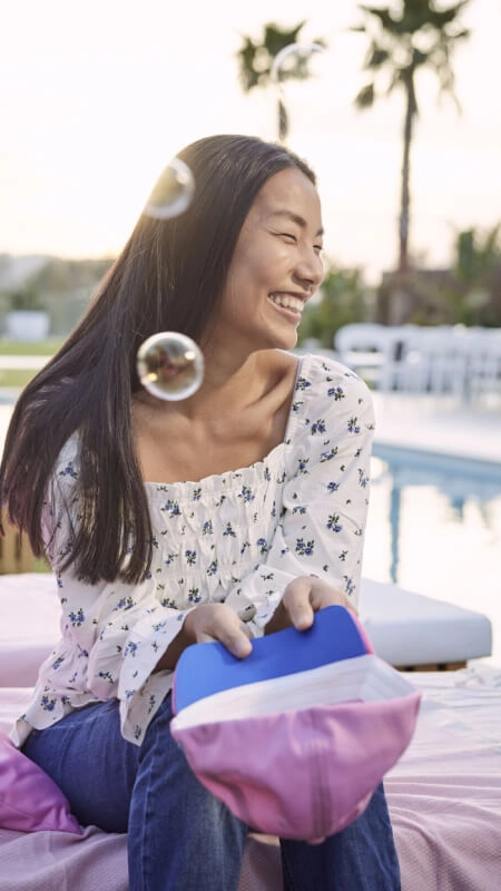 Woman Sitting Happily in Front of BWT Pool