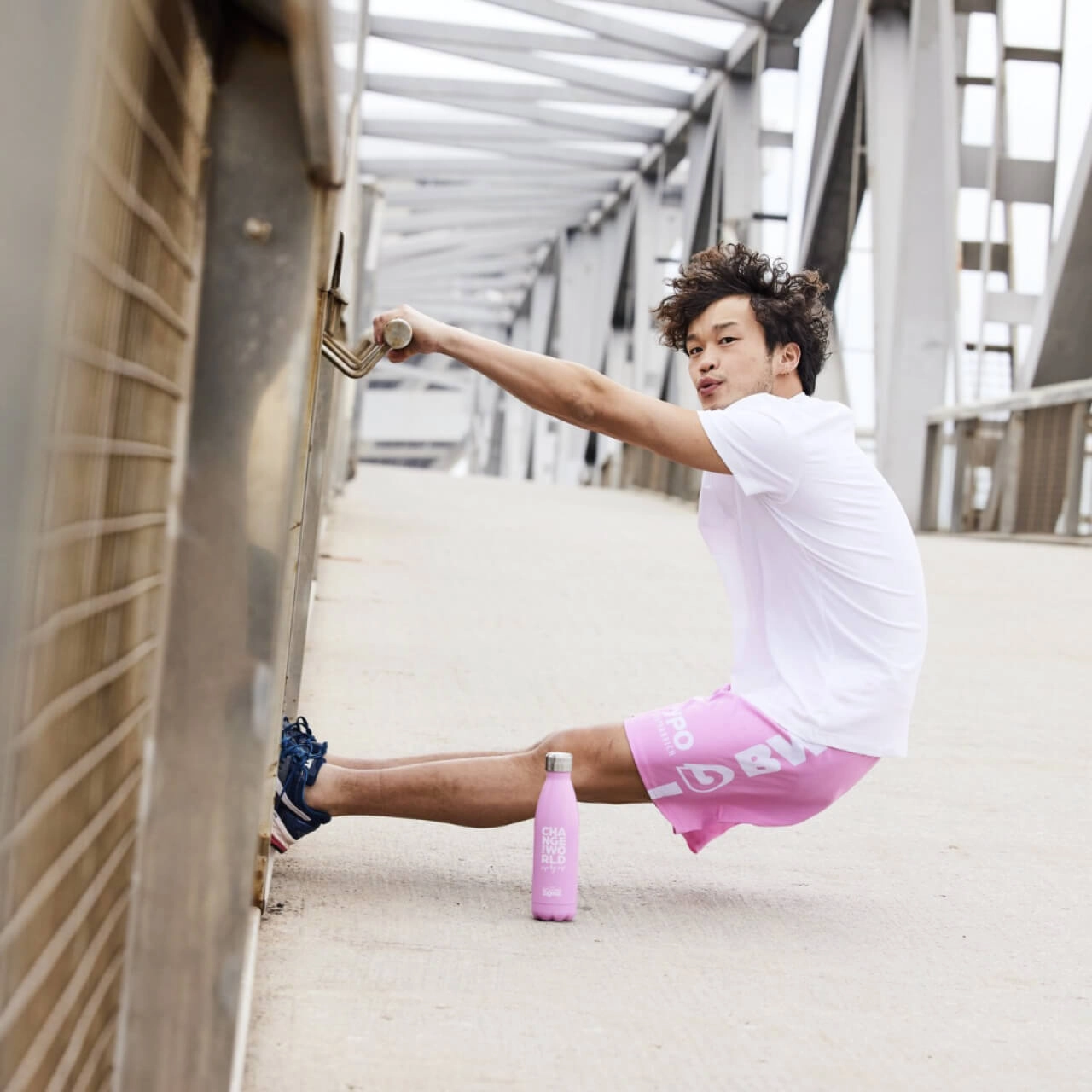 BWT Training apparel Man with pink BWT training shorts and bottle