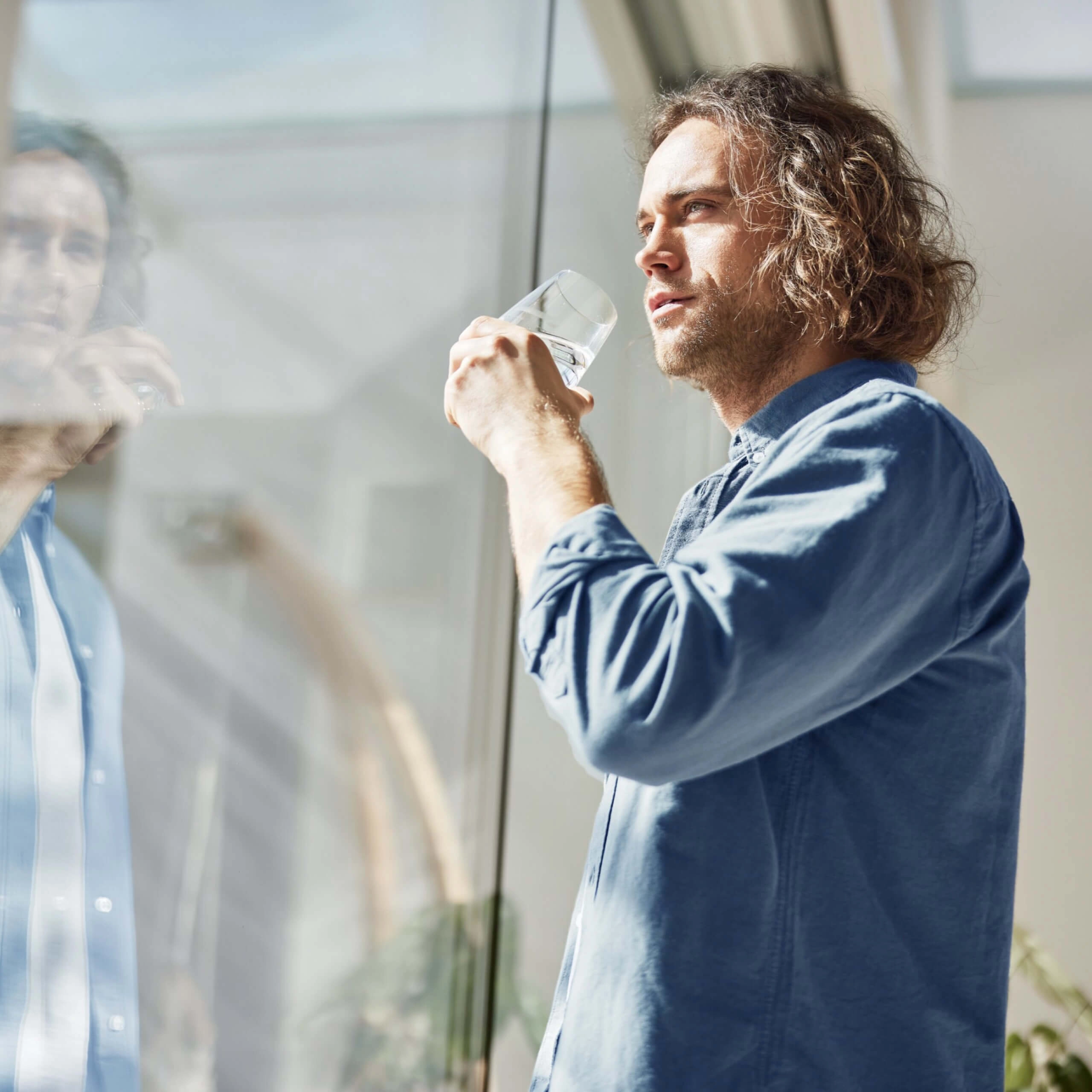 Man drinks from BWT water glass